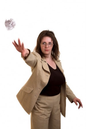 Woman throwing paper